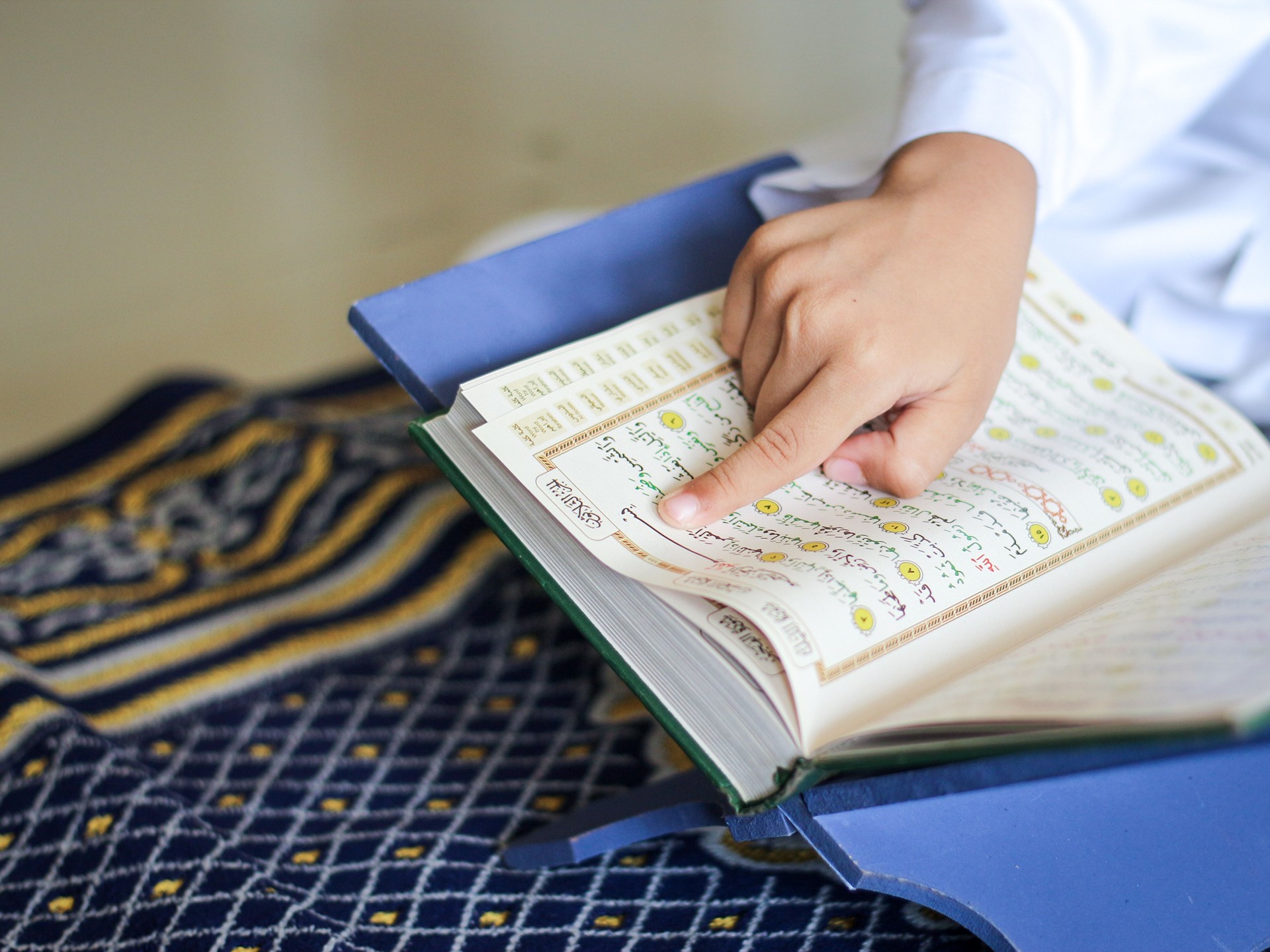 A child reading holy Koran photo illustration.