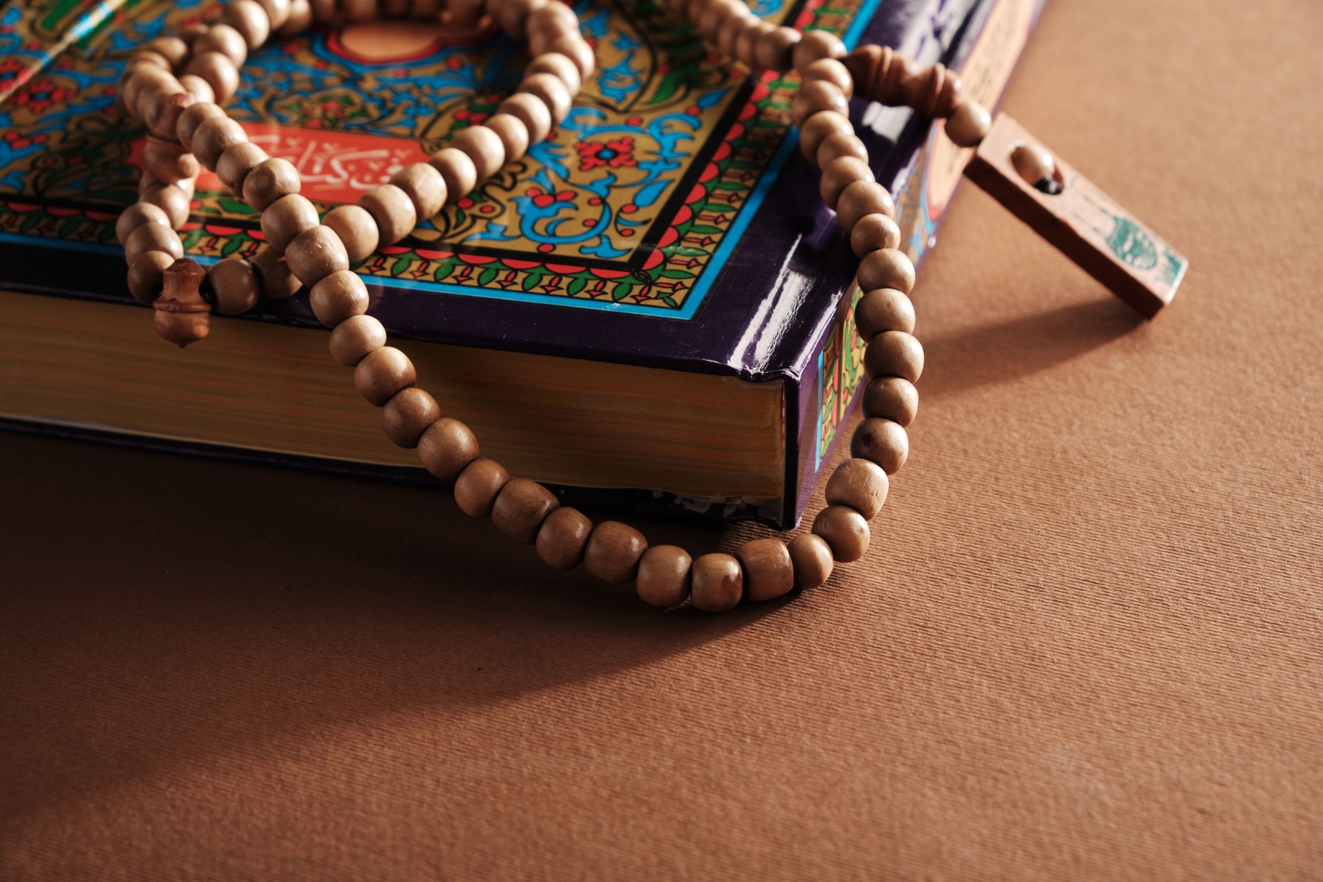 prayer beads and holy koran